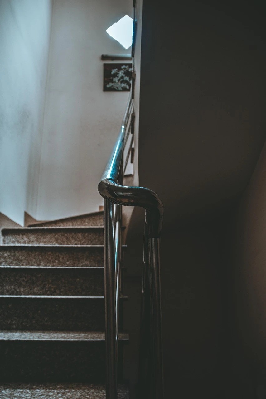 low-angle-view-of-spiral-staircase-against-black-background-247676